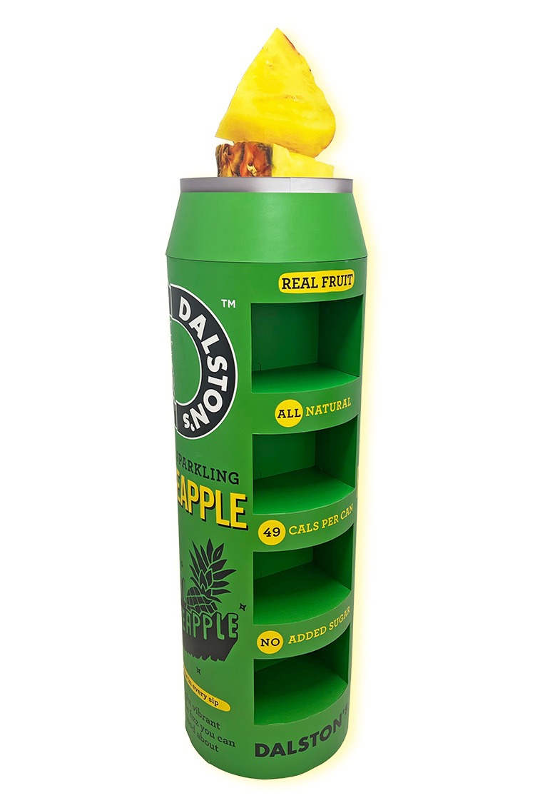 An FSDU retail display with 4 shelfs and header that is shaped as pineapple chunks whilst the unit is based on the shape of the products can