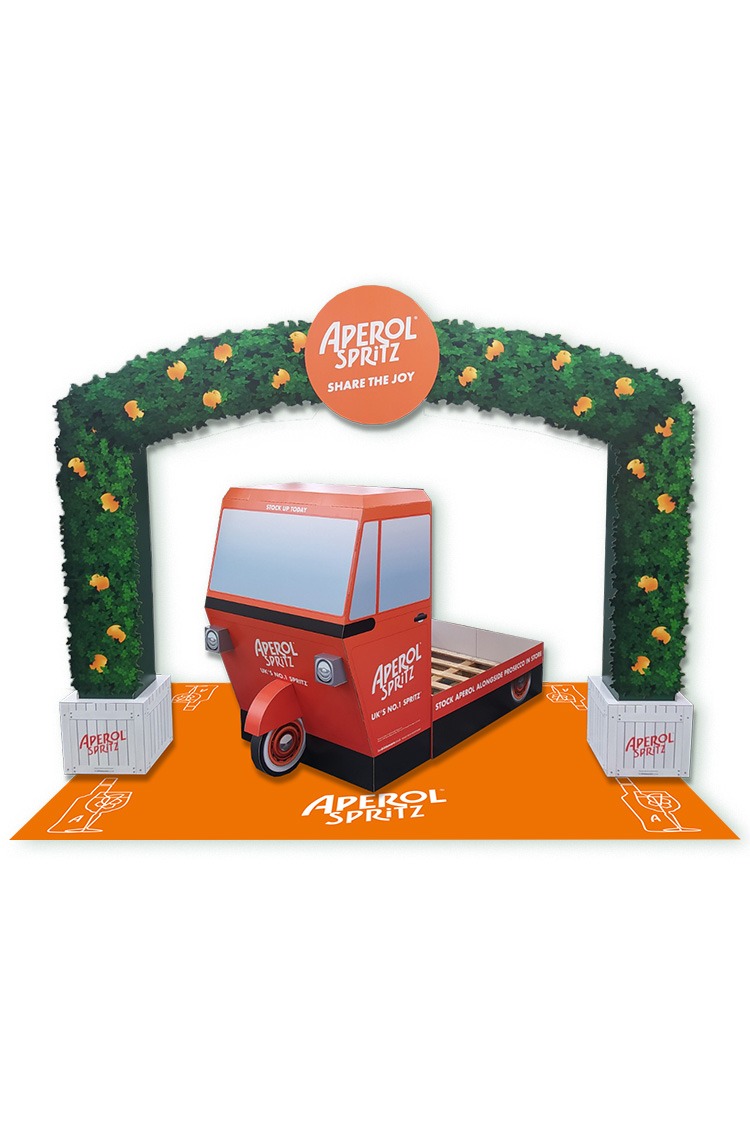 An image showing a cardbaord Arch and Tuk Tuk Vehicle